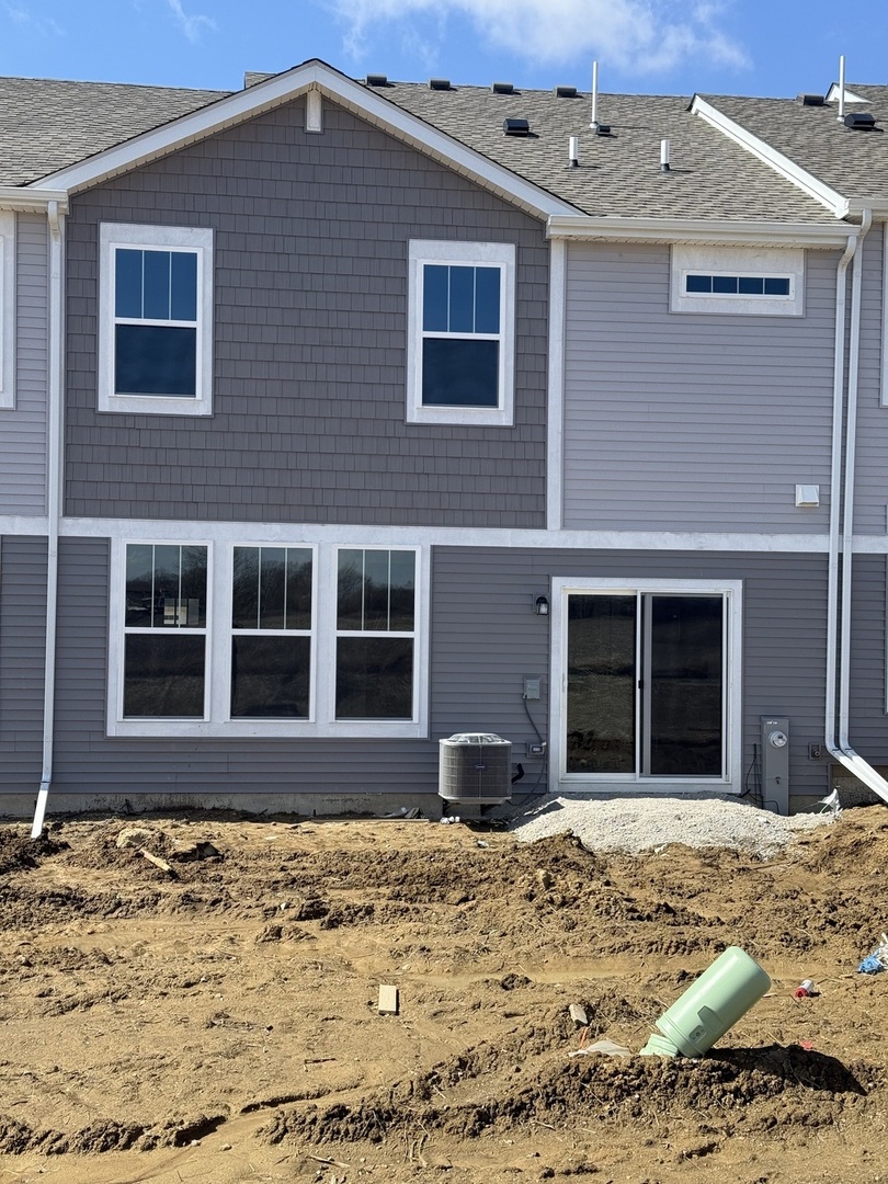10232 McMahon Way, Unit 10232 Huntley, IL 60142 - Photo 22 of 22 a view of a house with a backyard