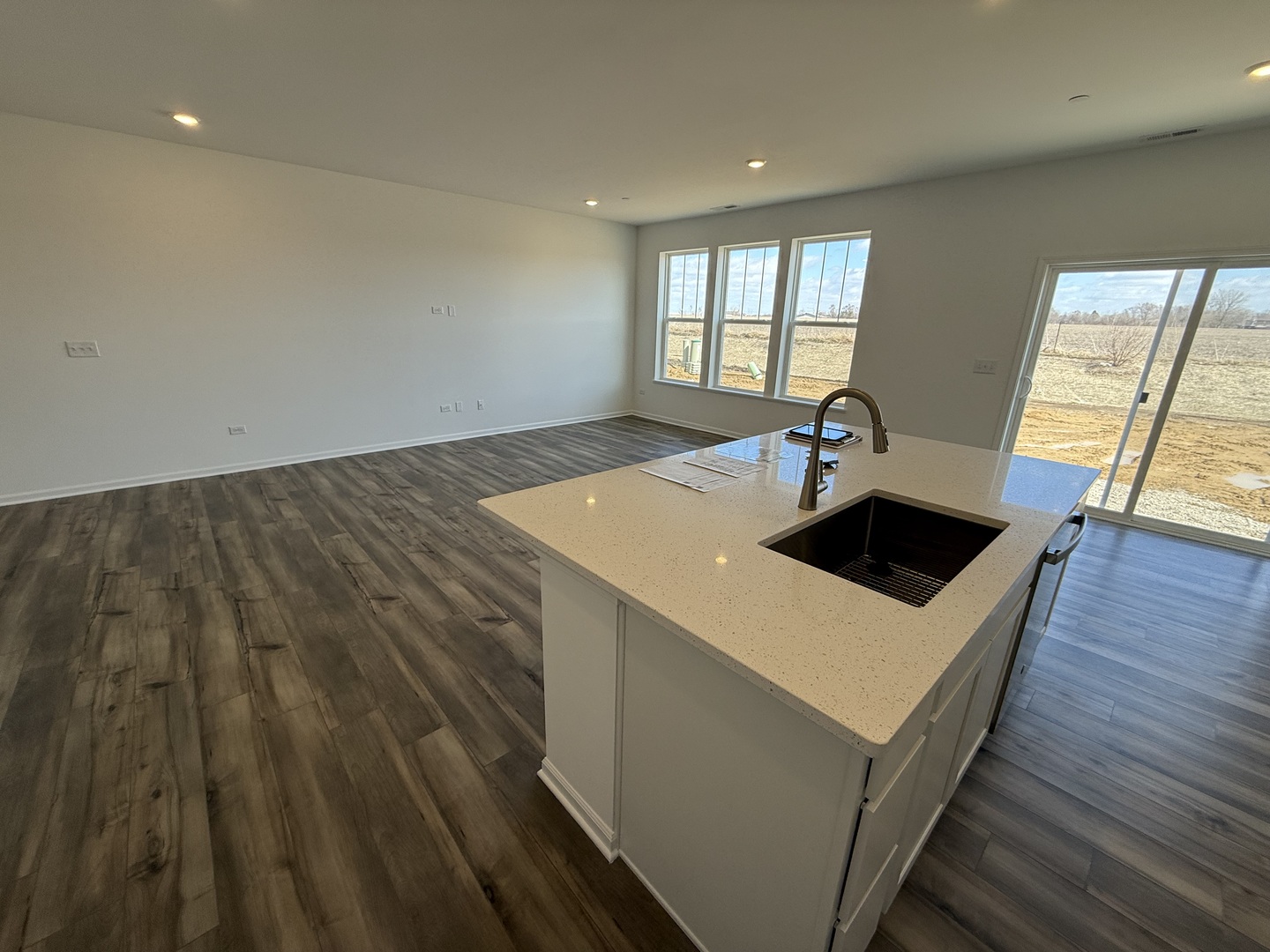10232 McMahon Way, Unit 10232 Huntley, IL 60142 - Photo 8 of 22 a kitchen with a sink and wooden floor