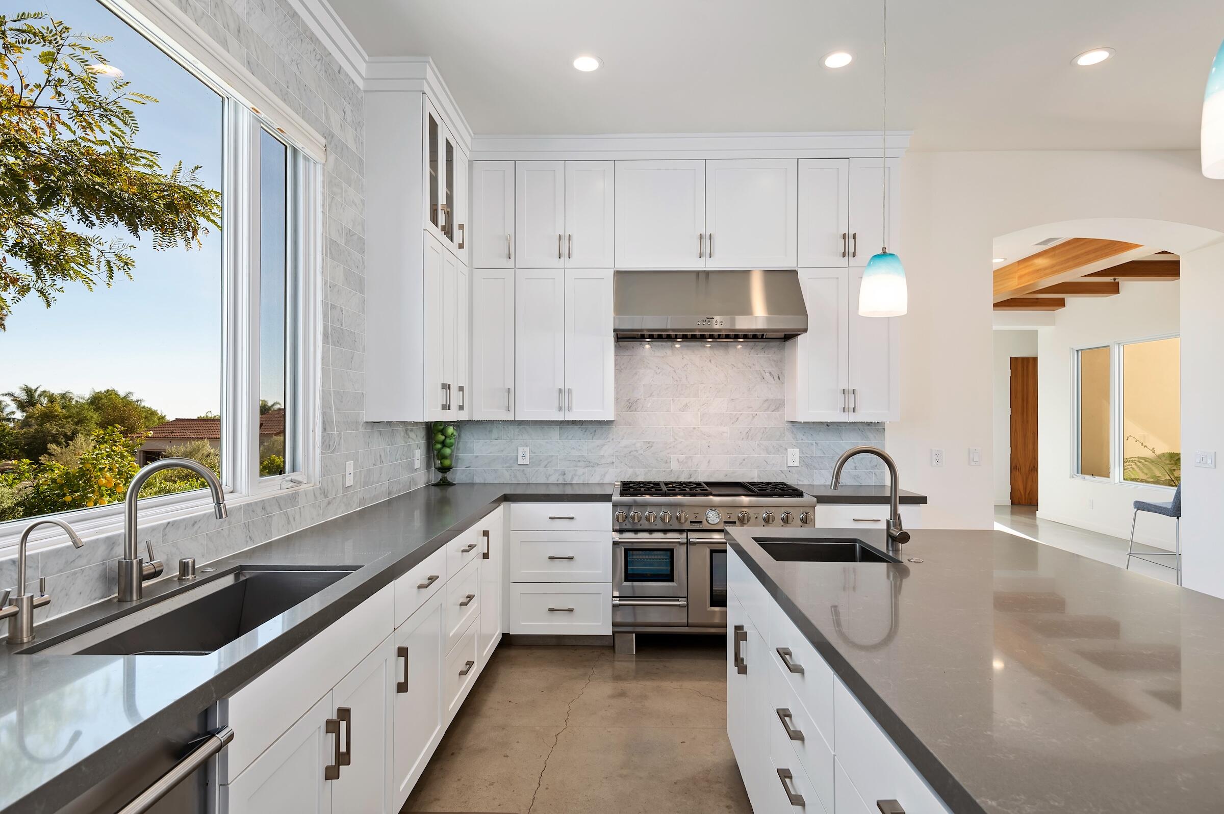 1367 Via Veneto Santa Barbara, CA 93111 - Photo 11 of 38 a kitchen with stainless steel appliances granite countertop a sink stove and cabinets