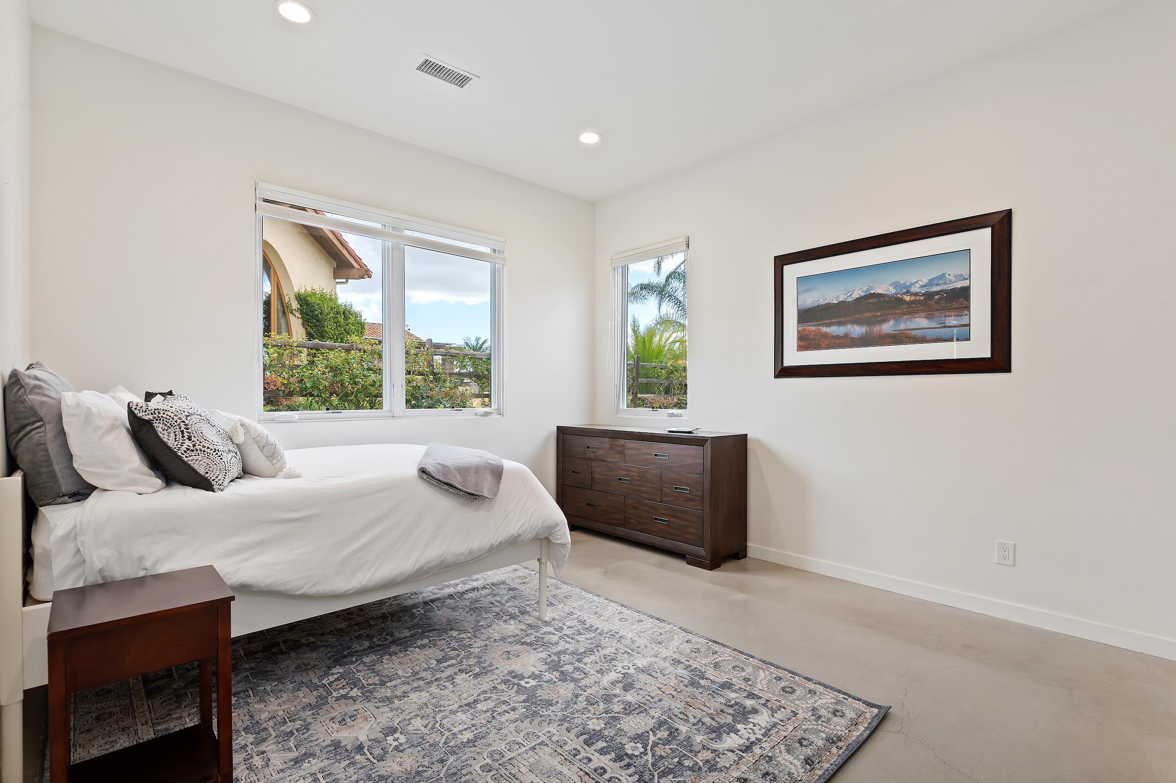 1367 Via Veneto Santa Barbara, CA 93111 - Photo 29 of 38 a bedroom with a bed and a couch