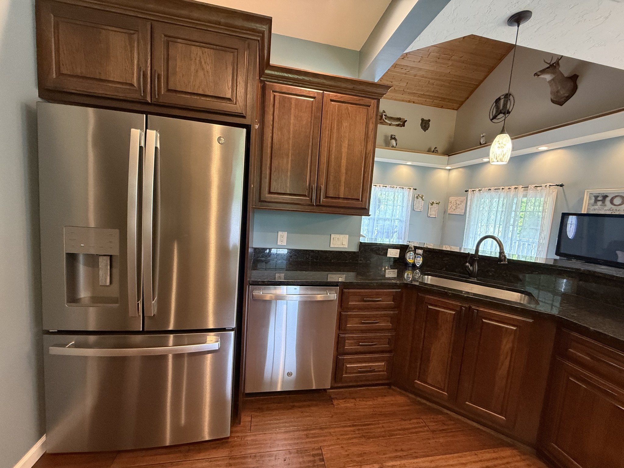 581 Shady Grove Road Bloomington Springs, TN 38545 - Photo 16 of 42 a kitchen with stainless steel appliances granite countertop a refrigerator and a sink