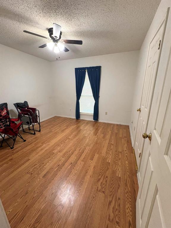 27 Sundown Trail Star Harbor, TX 75148 - Photo 22 of 32 a view of empty room with wooden floor