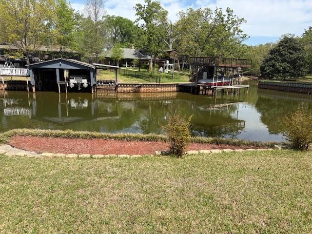 27 Sundown Trail Star Harbor, TX 75148 - Photo 30 of 32 a view of a lake with a yard and large trees