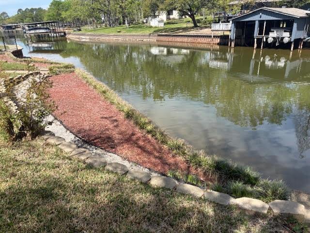 27 Sundown Trail Star Harbor, TX 75148 - Photo 31 of 32 a view of a lake with a house in the background