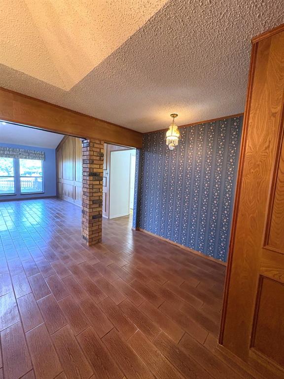 27 Sundown Trail Star Harbor, TX 75148 - Photo 5 of 32 a view of empty room with wooden floor