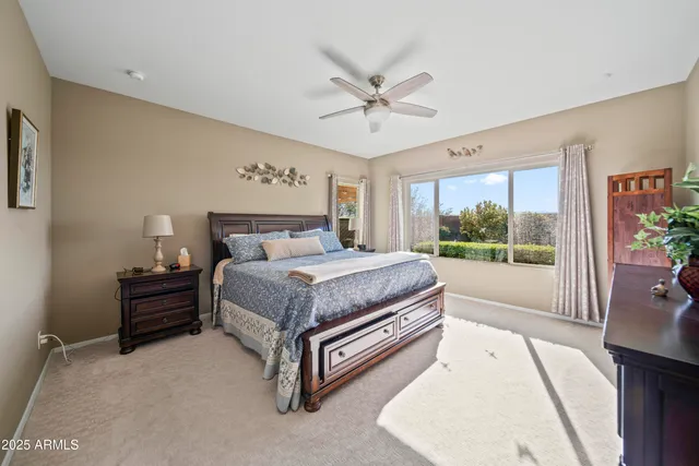 a bed room with a bed and a window