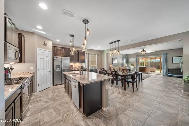 a kitchen with lots of counter top space and dining table
