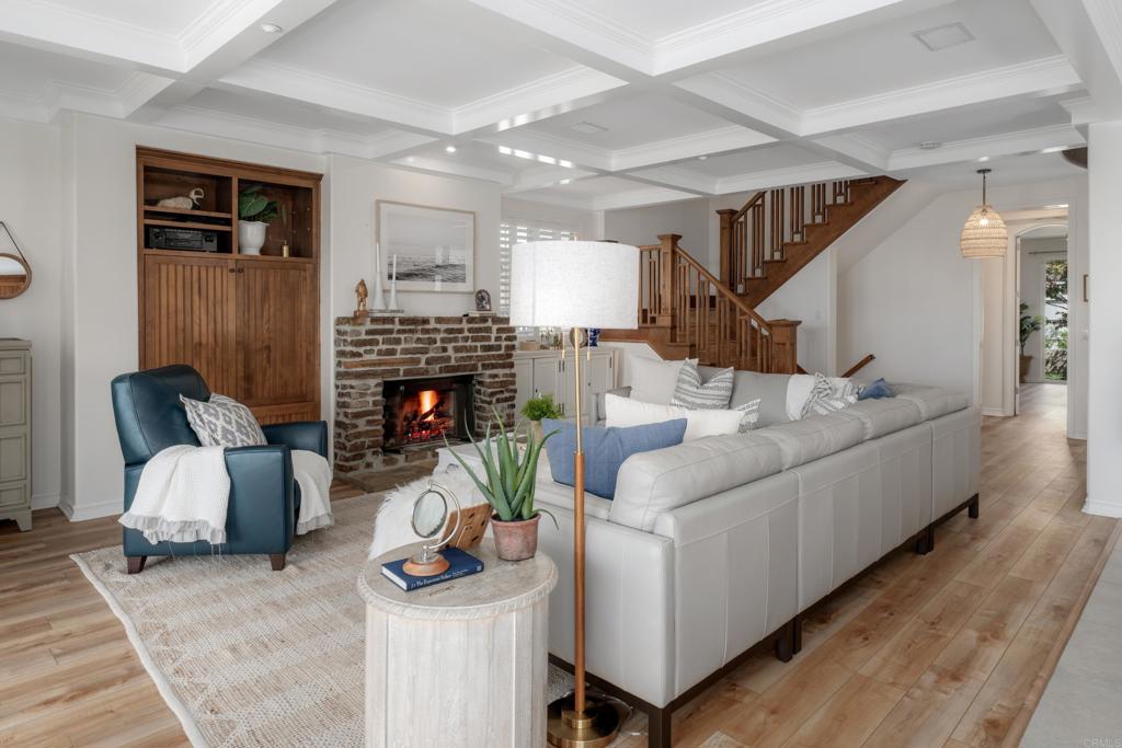 1483 Neptune Avenue Encinitas, CA 92024 - Photo 11 of 46 a living room with furniture and a fireplace