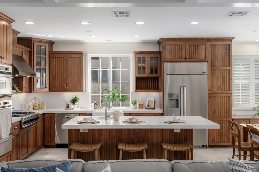 1483 Neptune Avenue Encinitas, CA 92024 - Photo 12 of 46 a kitchen with a sink counter and chairs