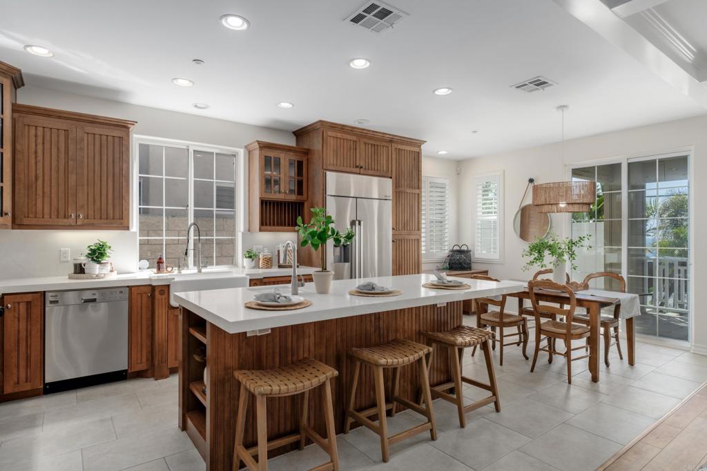 1483 Neptune Avenue Encinitas, CA 92024 - Photo 13 of 46 a open dining room with stainless steel appliances granite countertop a sink and a large window
