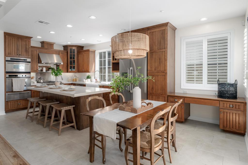 1483 Neptune Avenue Encinitas, CA 92024 - Photo 15 of 46 a dining room with furniture and a floor to ceiling window