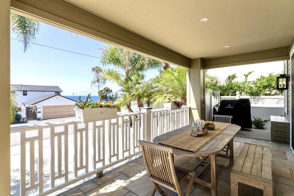 1483 Neptune Avenue Encinitas, CA 92024 - Photo 17 of 46 a view of a patio with a table chairs and a patio
