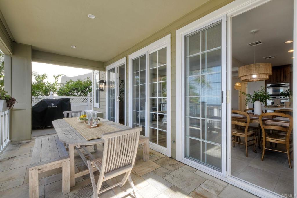 1483 Neptune Avenue Encinitas, CA 92024 - Photo 19 of 46 a view of a dining room with furniture window and outside view