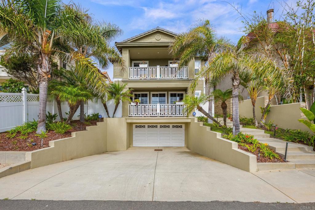 1483 Neptune Avenue Encinitas, CA 92024 - Photo 2 of 46 a front view of a house with a yard and garage