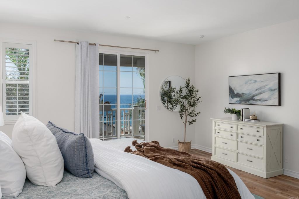 1483 Neptune Avenue Encinitas, CA 92024 - Photo 21 of 46 a bedroom with a bed and a window