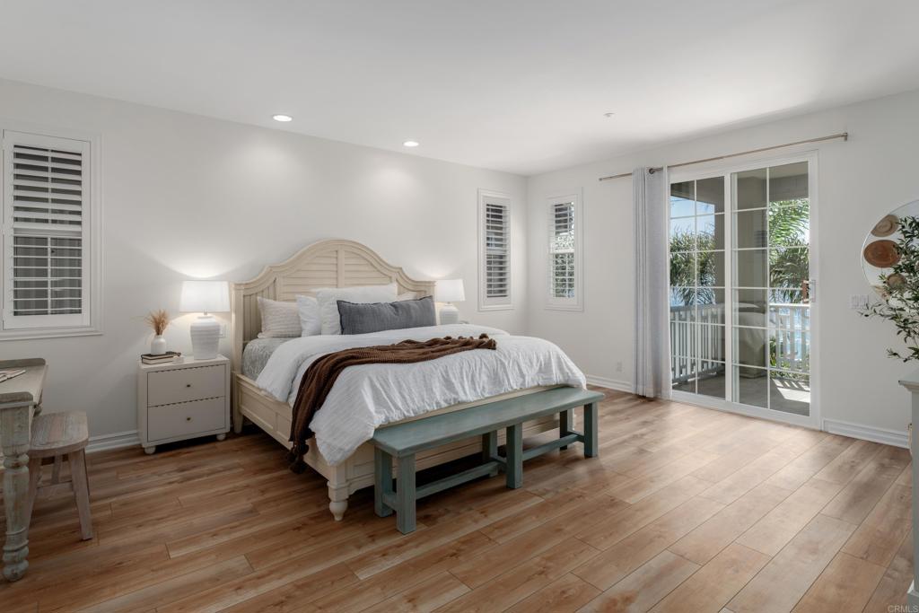 1483 Neptune Avenue Encinitas, CA 92024 - Photo 22 of 46 a bed sitting in a spacious bedroom next to a window