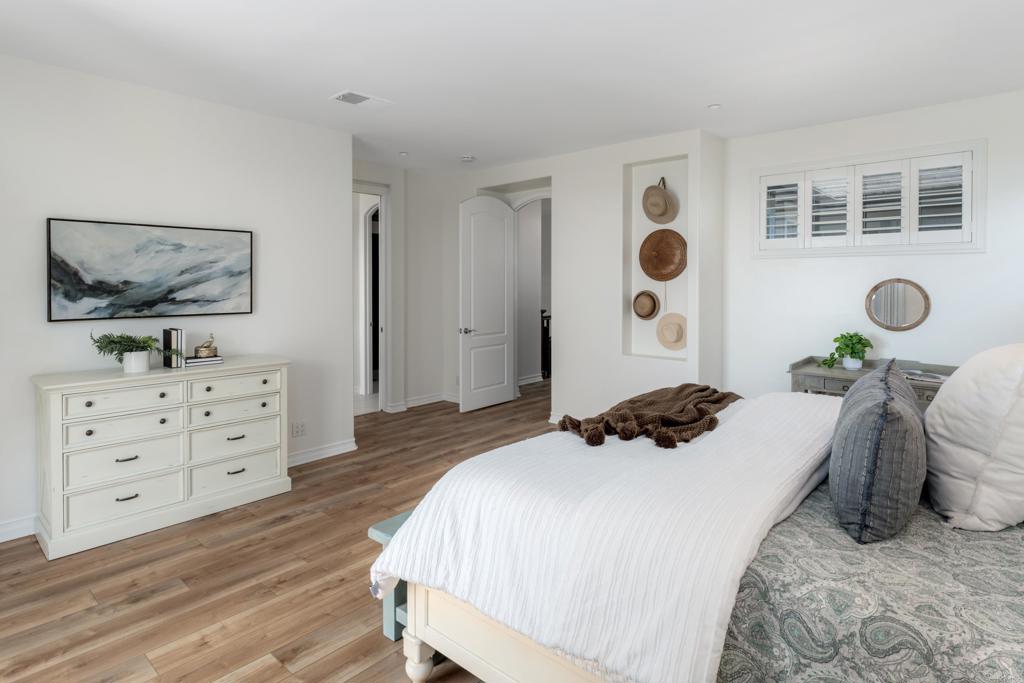 1483 Neptune Avenue Encinitas, CA 92024 - Photo 23 of 46 a bedroom with a bed and a window