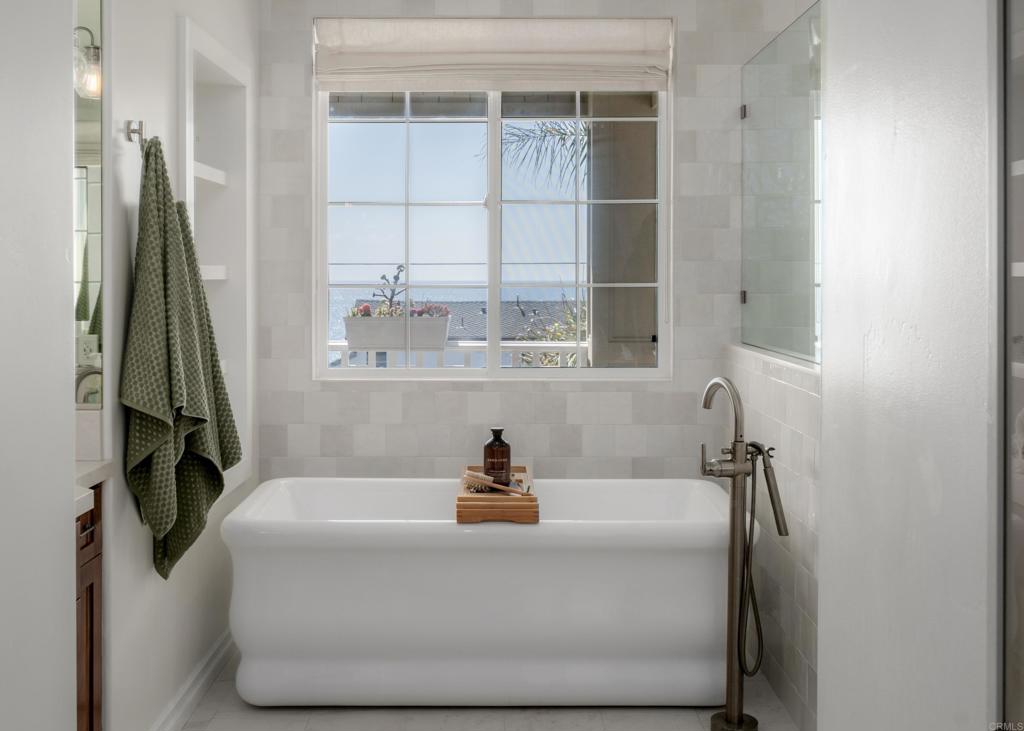 1483 Neptune Avenue Encinitas, CA 92024 - Photo 26 of 46 a white bath tub sitting next to a window
