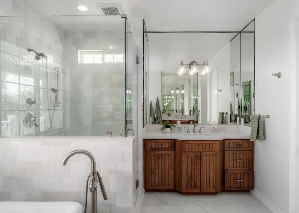 1483 Neptune Avenue Encinitas, CA 92024 - Photo 29 of 46 a bathroom with a double vanity sink and a mirror