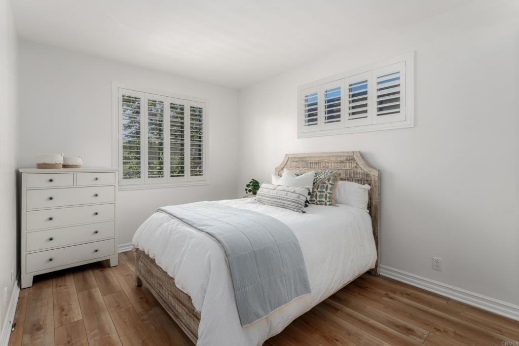 1483 Neptune Avenue Encinitas, CA 92024 - Photo 32 of 46 a bedroom with a bed and a window