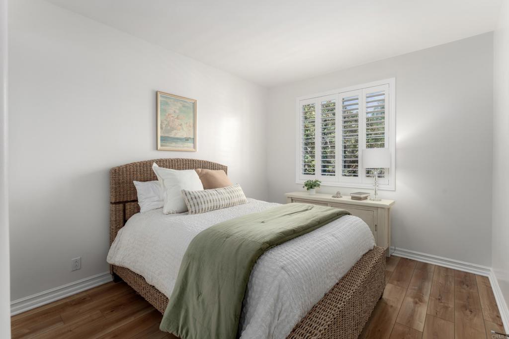 1483 Neptune Avenue Encinitas, CA 92024 - Photo 34 of 46 a bedroom with a bed and a window