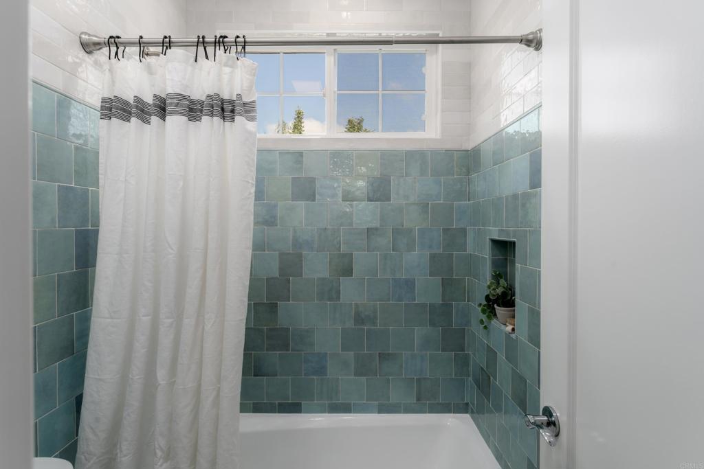 1483 Neptune Avenue Encinitas, CA 92024 - Photo 36 of 46 a bathroom with a shower and a sink