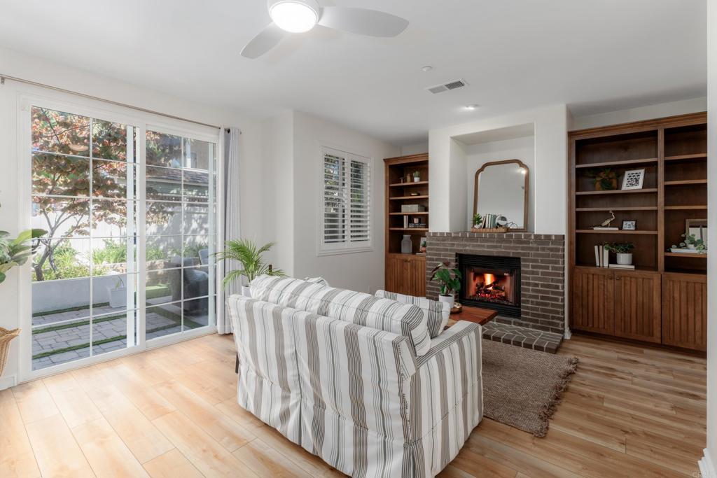 1483 Neptune Avenue Encinitas, CA 92024 - Photo 38 of 46 a living room with furniture and a fireplace