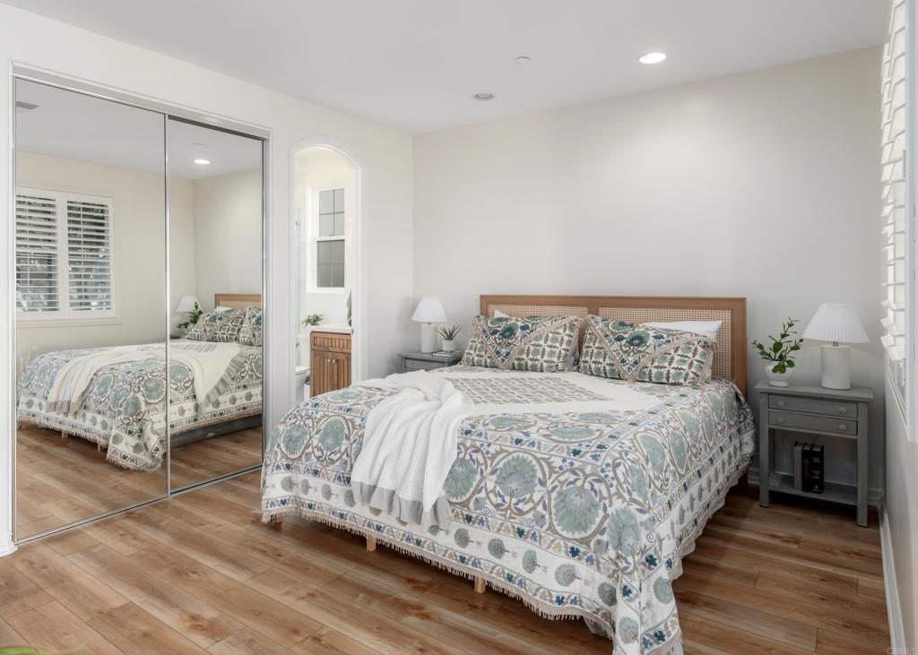 1483 Neptune Avenue Encinitas, CA 92024 - Photo 39 of 46 a bedroom with bed and wooden floor