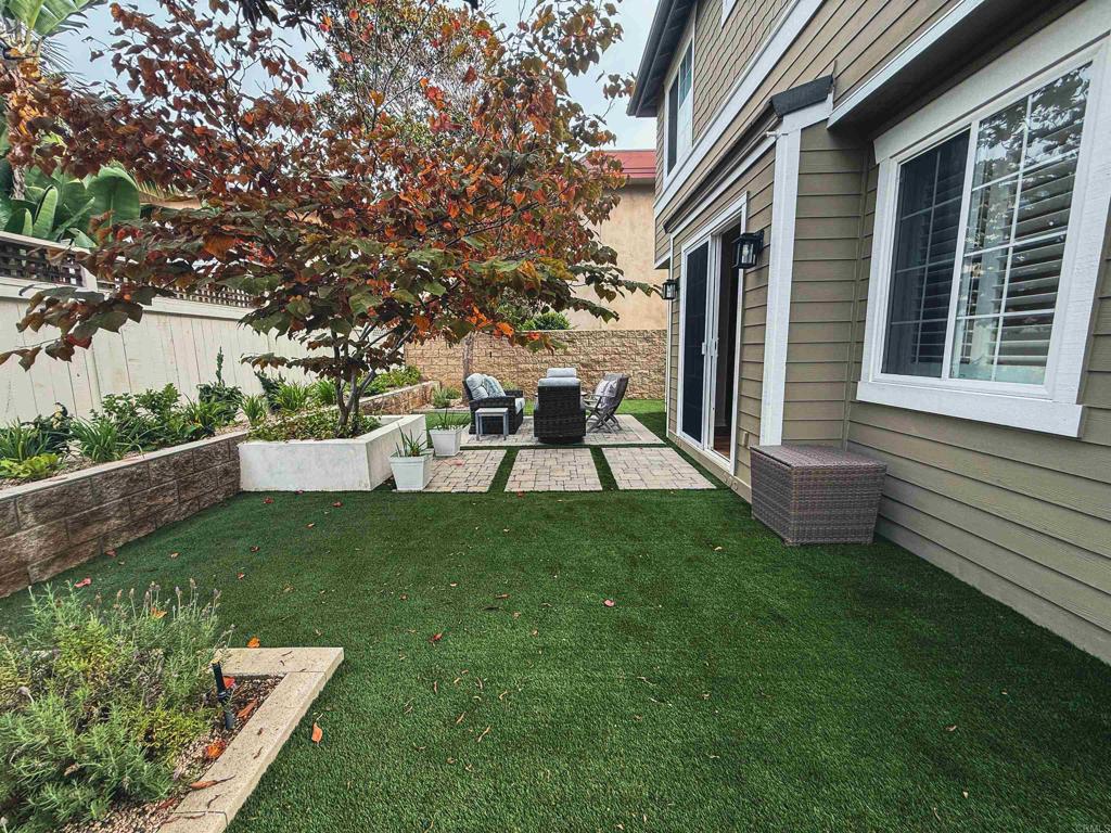 1483 Neptune Avenue Encinitas, CA 92024 - Photo 42 of 46 a view of a house with backyard sitting area and garden