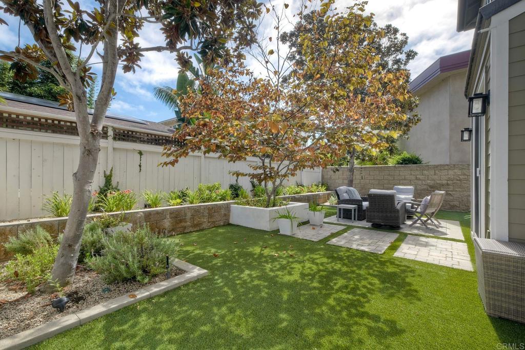 1483 Neptune Avenue Encinitas, CA 92024 - Photo 43 of 46 a backyard of a house with table and chairs
