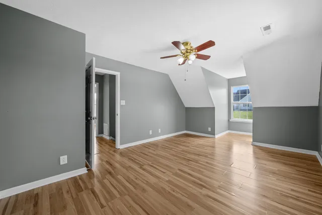 a view of balcony with wooden floor