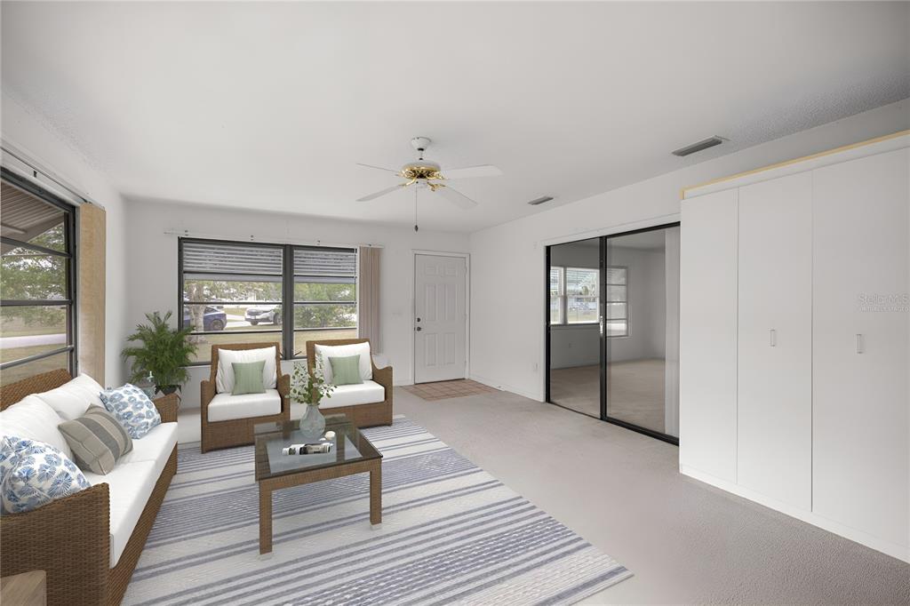 9230 Southwest 101st Lane Ocala, FL 34481 - Photo 12 of 31 a living room with furniture and wooden floor