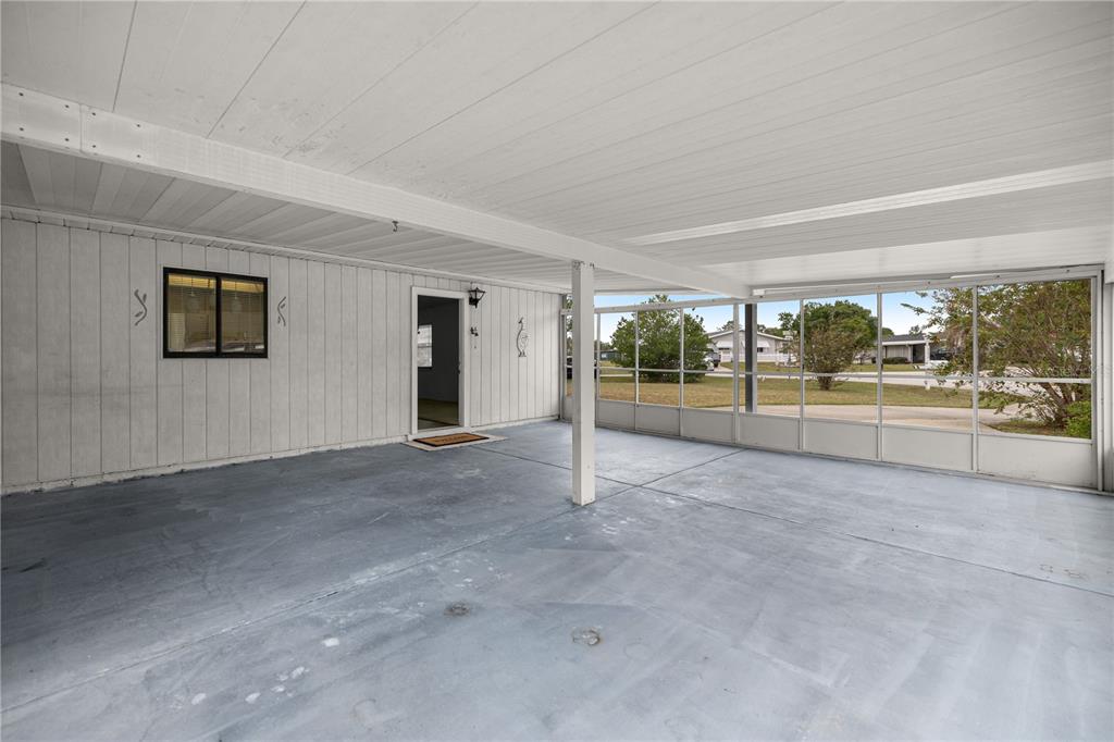 9230 Southwest 101st Lane Ocala, FL 34481 - Photo 24 of 31 a view of a big room with wooden floor and windows