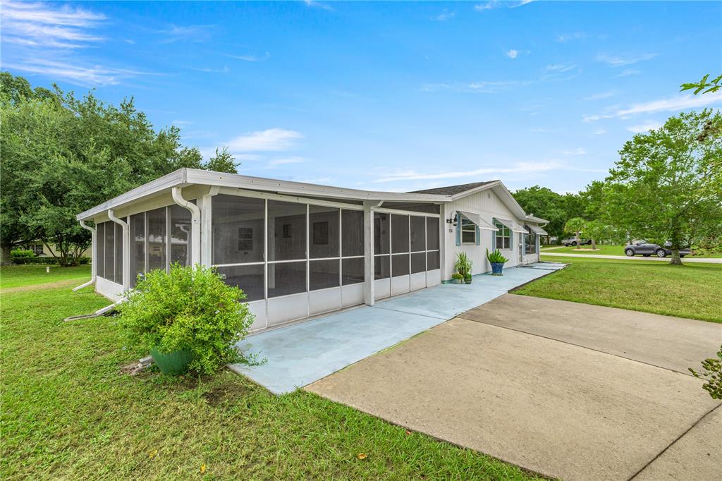 9230 Southwest 101st Lane Ocala, FL 34481 - Photo 27 of 31 a view of a house with a garden
