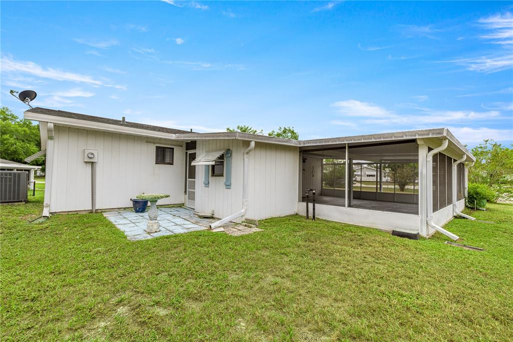 9230 Southwest 101st Lane Ocala, FL 34481 - Photo 30 of 31 a house view with a sitting space and garden