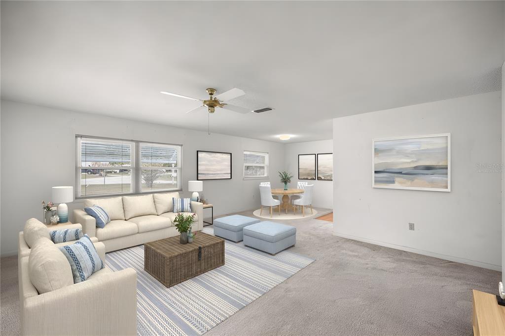 9230 Southwest 101st Lane Ocala, FL 34481 - Photo 3 of 31 a living room with furniture and a large window