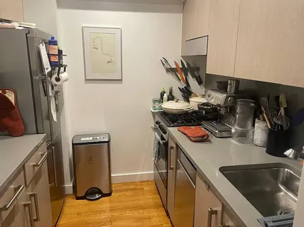 a view of a kitchen with a sink and dishwasher