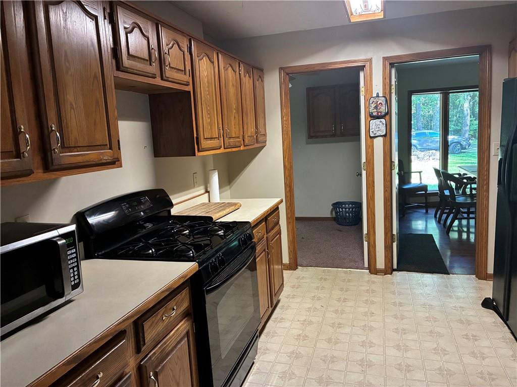 5569 East State Street Hermitage, PA 16148 - Photo 6 of 11 a kitchen with a stove and a refrigerator