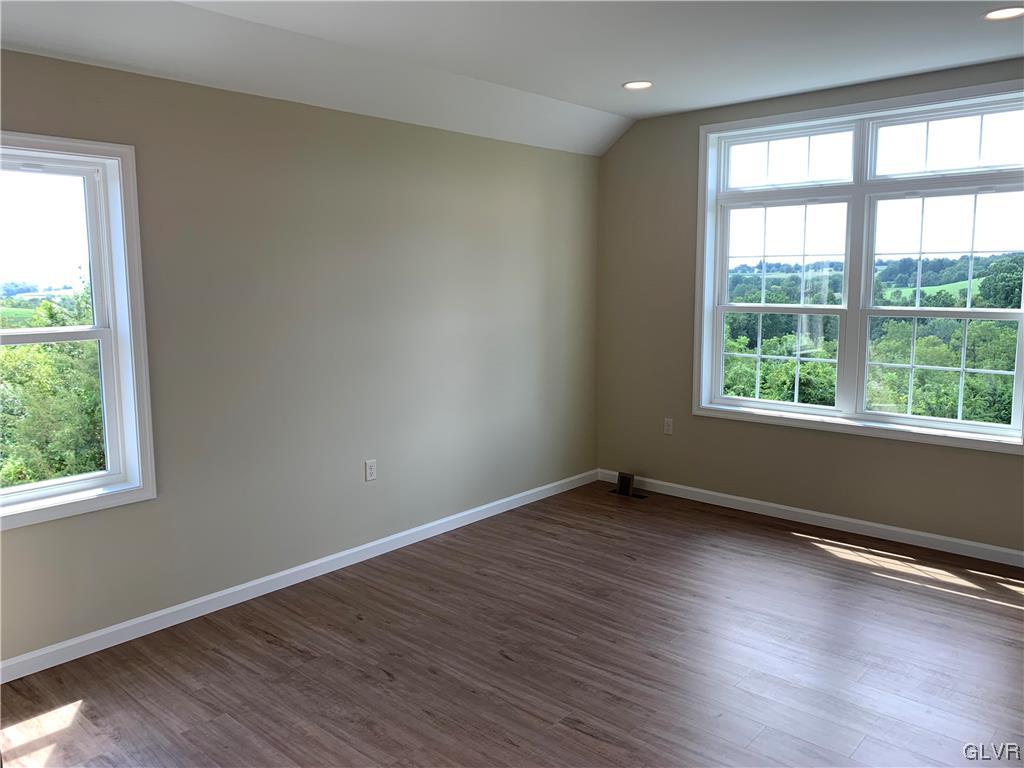 276 Hester Road Bangor, PA 18013 - Photo 16 of 26 a view of an empty room with wooden floor and a window