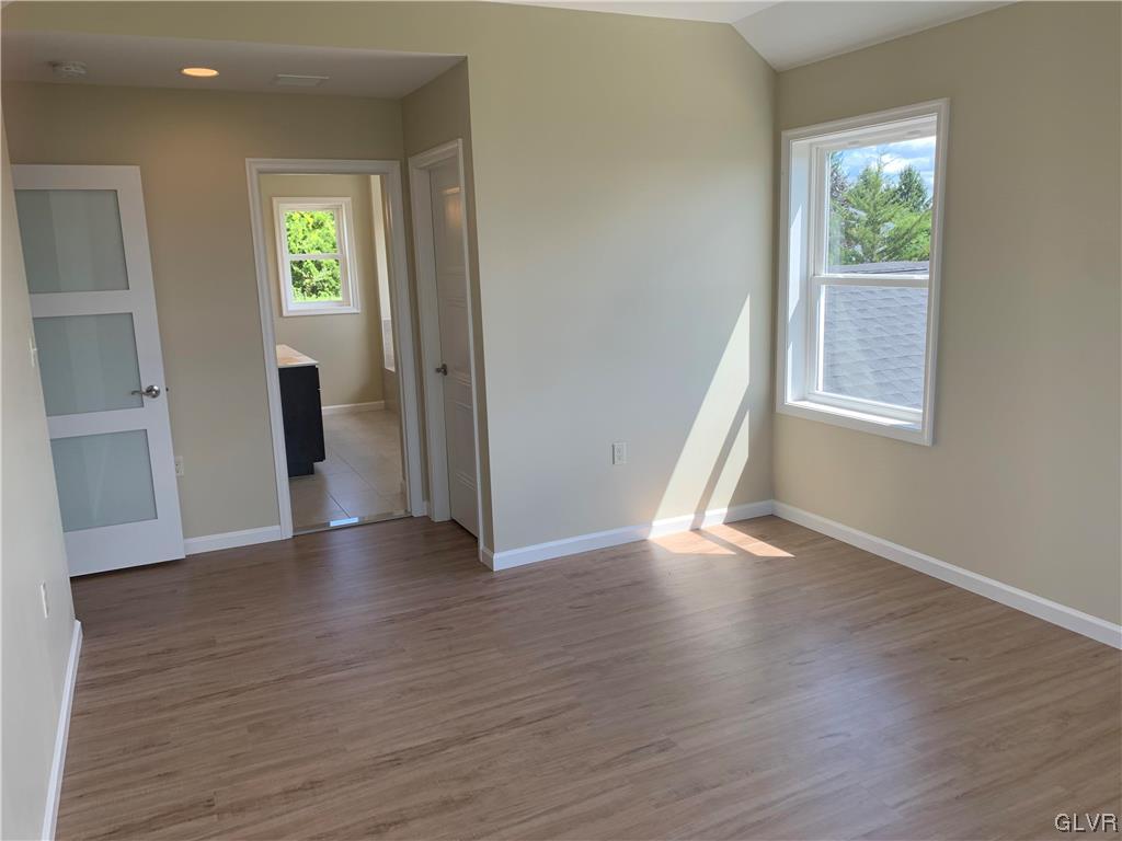 276 Hester Road Bangor, PA 18013 - Photo 17 of 26 an empty room with wooden floor and windows