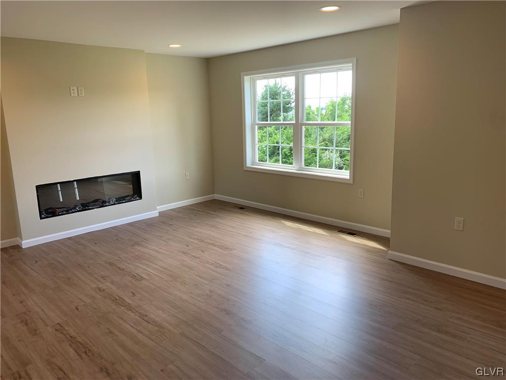 276 Hester Road Bangor, PA 18013 - Photo 5 of 26 a view of an empty room with wooden floor and a window