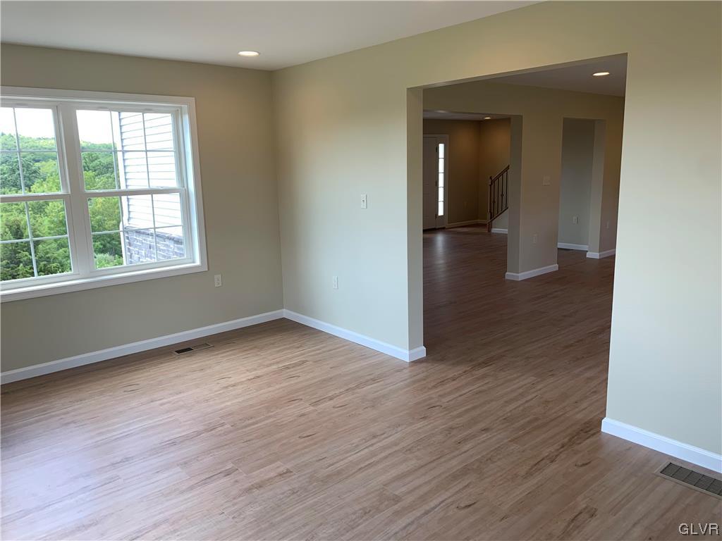 276 Hester Road Bangor, PA 18013 - Photo 8 of 26 an empty room with wooden floor and windows