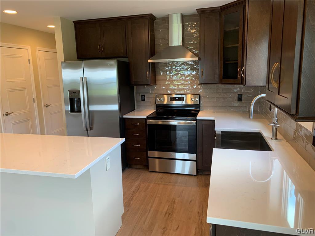 276 Hester Road Bangor, PA 18013 - Photo 10 of 26 a kitchen with stainless steel appliances a stove a refrigerator and a sink