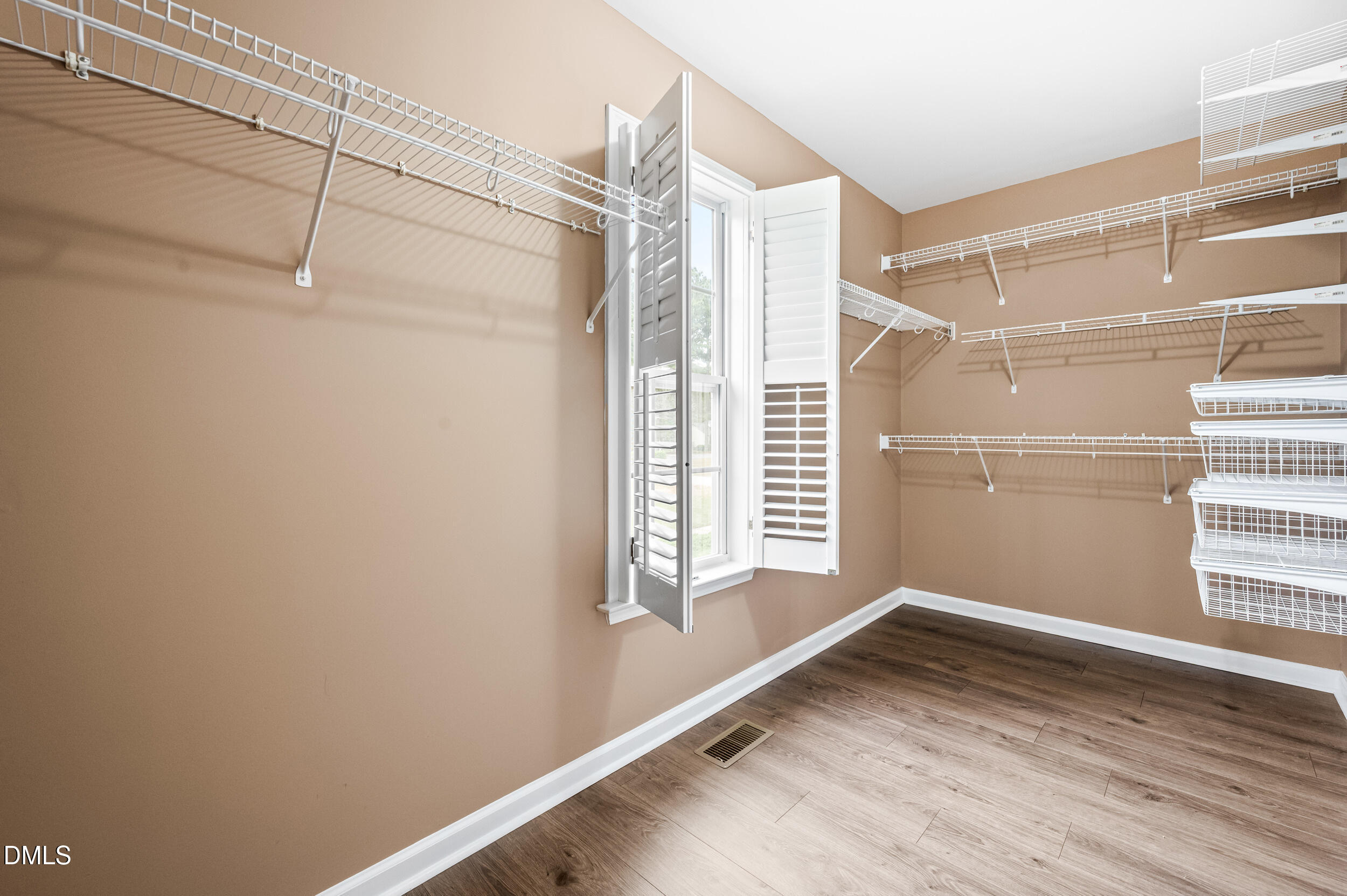 125 Rustic Lane Smithfield, NC 27577 - Photo 27 of 49 a view of a room with rack on the wall and a window