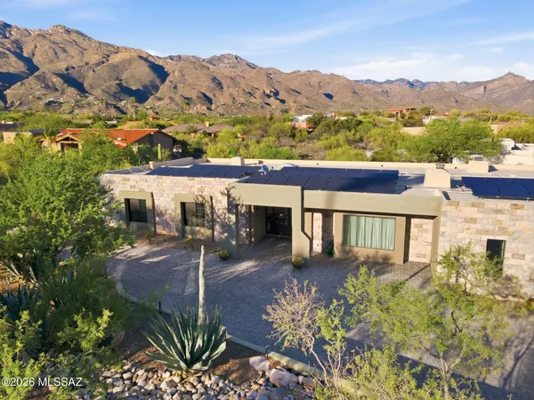 an aerial view of a house with a garden