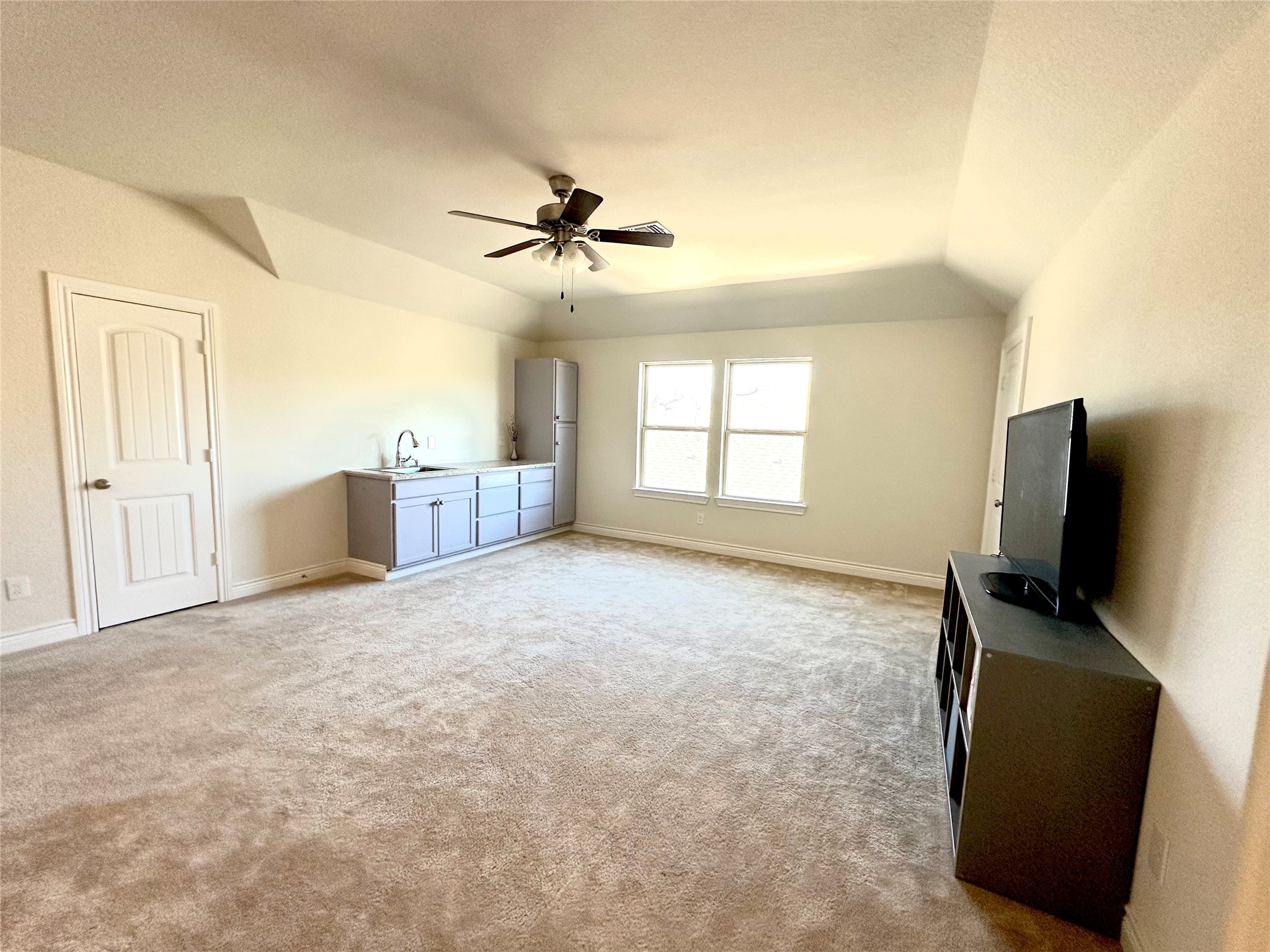 9719 Hazel Fern Court Spring, TX 77379 - Photo 15 of 21 a big room with windows and a flat screen tv