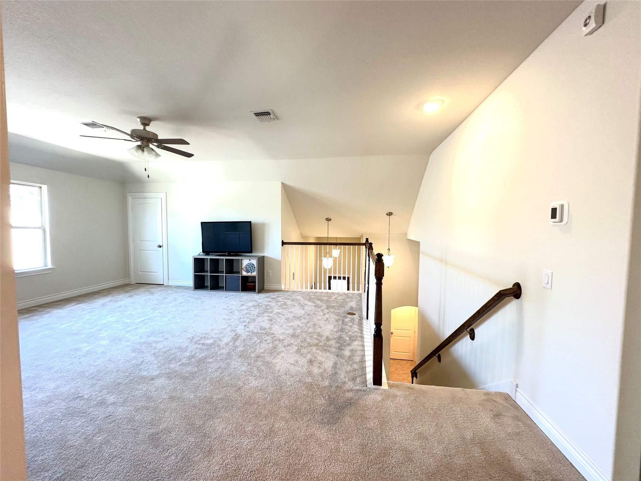 9719 Hazel Fern Court Spring, TX 77379 - Photo 16 of 21 a view of a livingroom with a ceiling fan