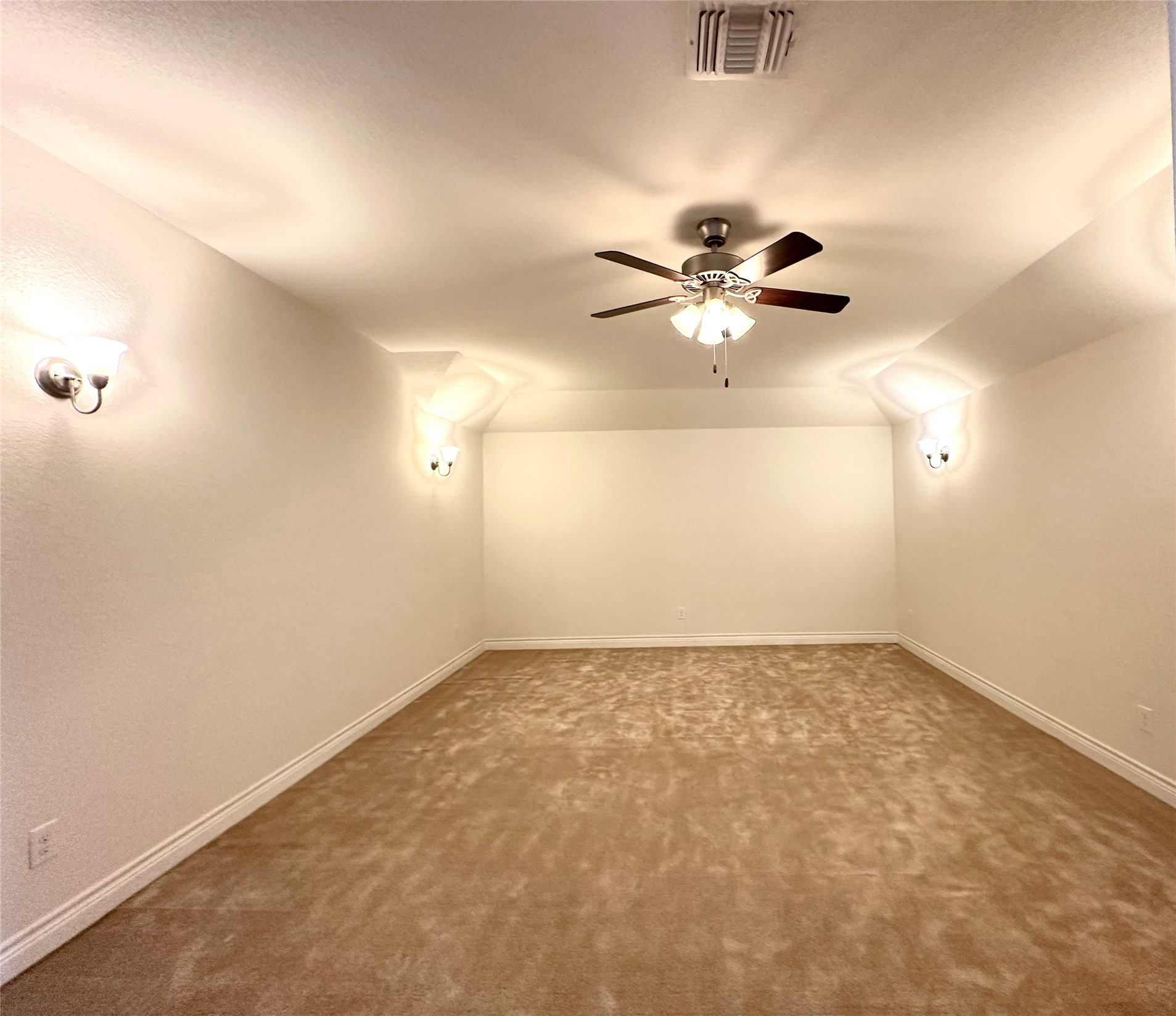 9719 Hazel Fern Court Spring, TX 77379 - Photo 17 of 21 an empty room with chandelier fan and windows
