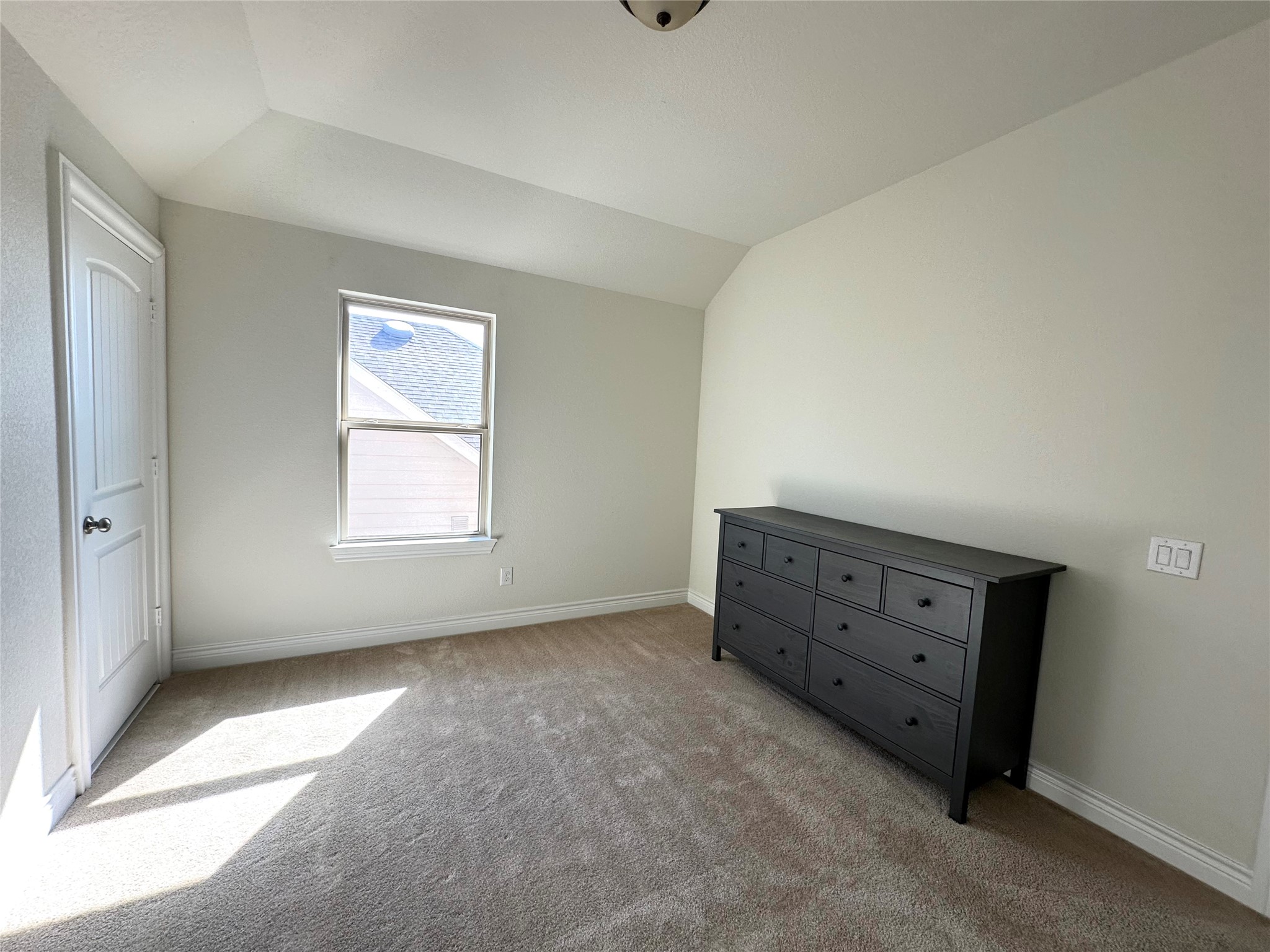 9719 Hazel Fern Court Spring, TX 77379 - Photo 18 of 21 a room with a dresser and a window
