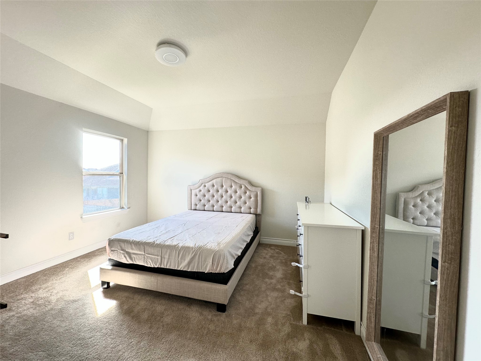 9719 Hazel Fern Court Spring, TX 77379 - Photo 19 of 21 a bedroom with a bed and window
